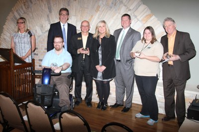 Recipients of the Neighwoods Award pose for a photograph with Mayor Bennett.